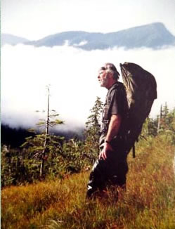 Johnnie Larid coming across an alpine muskeg